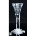 An 18th Century Jacobite drinking glass, circa 1745, the drawn trumpet bowl diamond point engraved