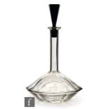 A 1930s glass ship?s decanter, probably Czechoslovakian, cut with flutes, with black conical