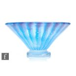 A 1930s Monart glass bowl of footed flared form decorated with internal tonal blue banded lines over