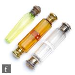 Three 19th Century glass scent bottles, to include two double-ended examples, the clear glass