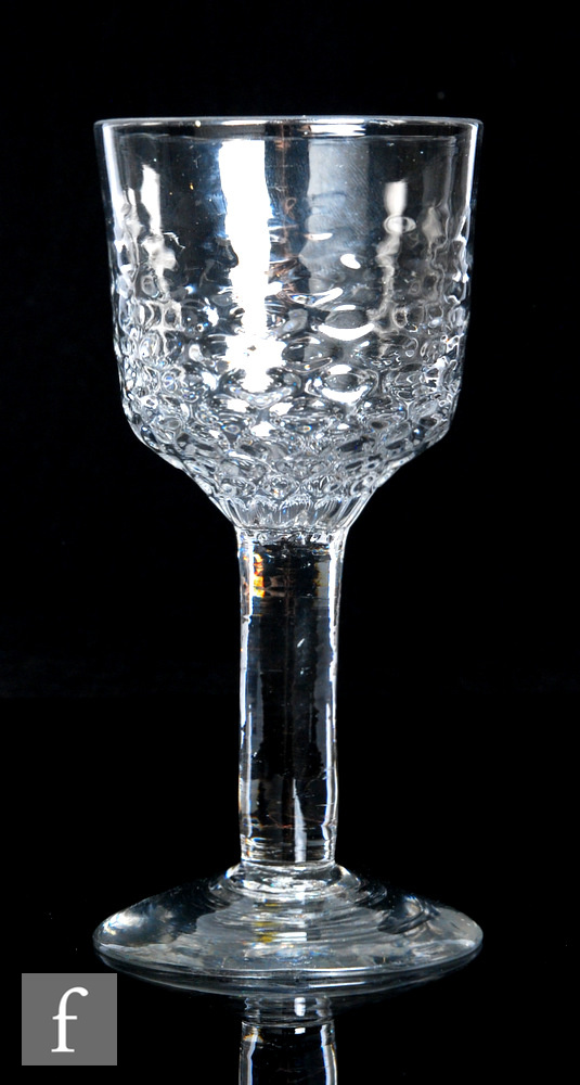 A large 18th Century goblet, circa 1750, the ogee form bowl with graduated honeycomb moulding from