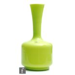 A 1960s Italian glass vase of mallet form in lime green, unmarked, retains Made in Italy foil label,