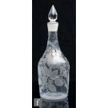 An 18th Century glass decanter, circa 1755, of shouldered form, the body profusely engraved with