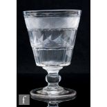 An early 19th Century oversized glass rummer, circa 1820, the bucket bowl decorated with a band of