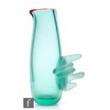 A later 20th Century studio glass jug by Karlin Rushbrooke, the body of swollen sleeve form in a
