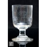 A mid 19th Century glass rummer, the bowl engraved with Masonic emblems and etched Exitus Acta