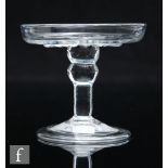 An 18th Century clear crystal glass patch stand, circa 1720, the shallow gadrooned dish raised to