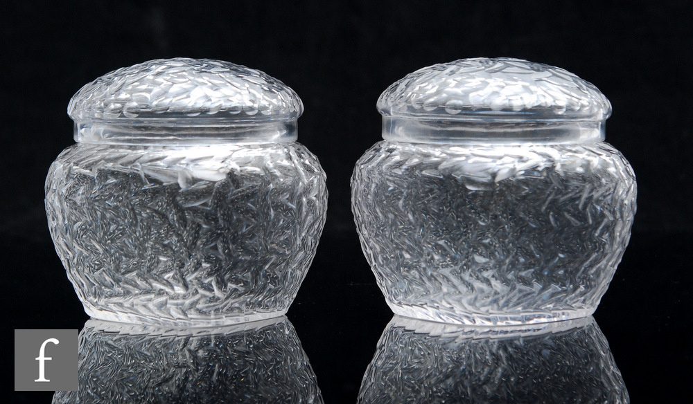 A pair of early 20th Century Stevens & Williams lidded clear crystal glass jars of shouldered square