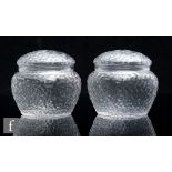 A pair of early 20th Century Stevens & Williams lidded clear crystal glass jars of shouldered square