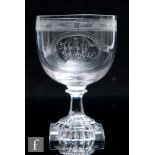 A late 18th Century glass rummer, the ovoid bowl engraved with a central oval cartouche with a