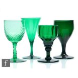 A group of four 19th Century Bristol green drinking glasses to comprise a fluted ogee form bowl
