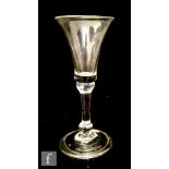 A mid 18th Century gin glass circa 1740, the bell bowl above a shoulder and basal knop stem,