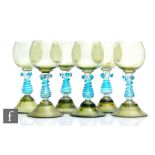 A set of six late 19th Century continental Roemer style wine glasses with green ovoid bowls above