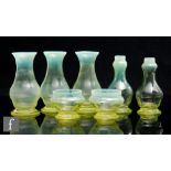 A small collection of 1930s Gray-Stan straw opal glass items, to include three vases of footed