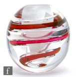 An Orrefors Ariel glass vase designed by Lars Hellsten, of globe form, with spiralling ruby and