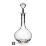 A later 19th century continental clear crystal decanter of compressed ovoid form with tall collar