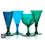 A group of four 19th Century Bristol green drinking glasses to comprise a slice cut conical bowl,
