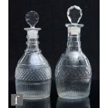 A Regency clear crystal decanter of Prussian form with banded flat cut decoration, engraved initials
