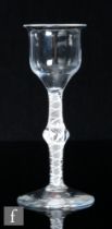 An 18th Century drinking glass, circa 1765, the ogee bowl over a double series opaque twist stem
