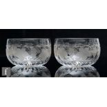 A set of four 19th Century clear crystal glass finger bowls, each hand engraved with a fruiting vine