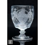 An early 19th Century glass rummer, circa 1810, the barrel form bowl engraved with a woman on a