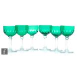 A set of six late 19th Century wine glasses, the green bowl with printie cuts above a clear