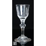 An 18th Century composite drinking glass circa 1750, the ogee form bowl falling to a solid basal