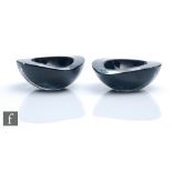 A pair of small 1950s Nuutajarvi Notsjo bowls of tear drop form, cased in clear crystal over black