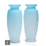 A pair of late 19th Century Stourbridge quilted air trap satin glass vases of footed barrel form