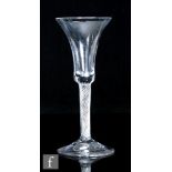 An 18th Century wine glass circa 1745, the waisted bell bowl with multi series air twist stem, the