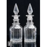 A pair of early Victorian Bludgeon shape decanters each with pillar cut body and slice cut