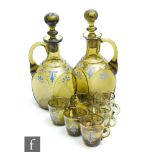 A pair of late 19th Century Bohemian decanters, of square section with collar neck and applied