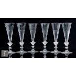 A set of six 19th Century Champagne flutes, the clear crystal glass trumpet bowl with basal slice