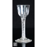 An 18th Century drinking glass, circa 1750, the ogee bowl above a double series air twist stem