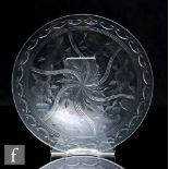 An early 20th Century Stourbridge glass ice plate of circular form, polished intaglio cut with