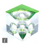 A Peter Botos glass sculpture of cube form with applied green glass top with polished concave