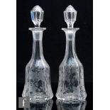 A pair of 19th Century glass decanters of bell form, possibly Stourbridge, circa 1860, the body