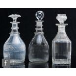A Regency clear crystal decanter of Prussian form with basal fluting and slice cut shoulders,