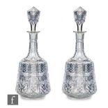 A pair of later 19th Century, possibly Belgian, clear crystal decanters of shouldered form, the body