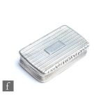 A Georgian hallmarked silver cushioned rectangular snuff box with reeded decoration and foliate