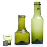 Two Tapio Wirkkala for Iittala carafes, Finland, circa 1958-68, deep olive green, the necks of