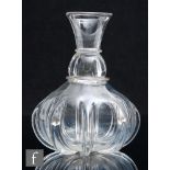 A late Georgian clear crystal glass carafe with a heavily lobed body rising to a ringed neck and