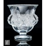 A later 20th Century Lalique glass pedestal vase decorated in the Dampierre pattern, moulded with