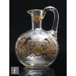A late 19th Century continental clear crystal glass ewer, possibly Bohemian, the spherical body with