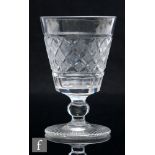 An early 19th Century glass rummer, circa 1810, the bucket bowl with hobnail cut decoration, above a