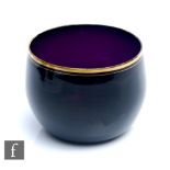 A late Georgian amethyst glass finger bowl, circa 1820, the swollen cylindrical body with a double