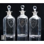 A set of three 18th Century glass spirit decanters, circa 1785, each of square section with canted