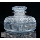 A late Georgian Anglo-Irish clear crystal glass tea caddy of rounded square section with mitre and