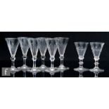 A set of six late 19th Century clear crystal wine glasses, the conical bowl with basal slice cut