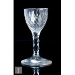 An 18th Century drinking glass, circa 1785, the round funnel bowl facet cut with hollow diamonds